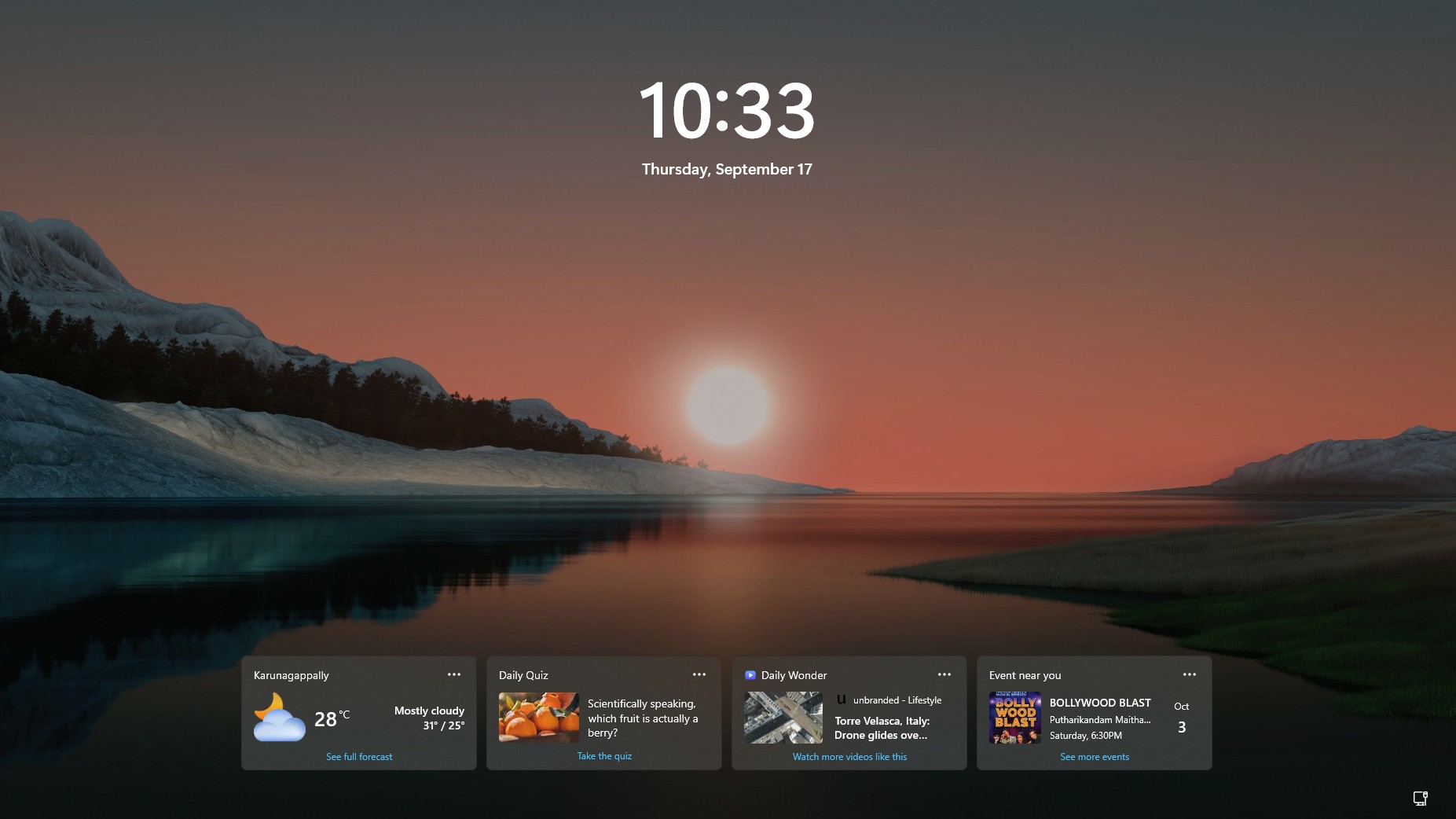 Older Windows 11 lock screen with multiple MSN widgets